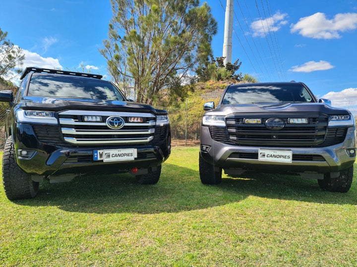 Two Toyota Land Cruisers with grille lights
