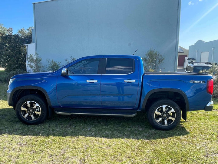 side view of blue Volkswagen Amarok