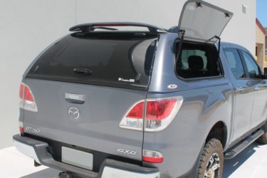 Mazda with ute canopy side window open