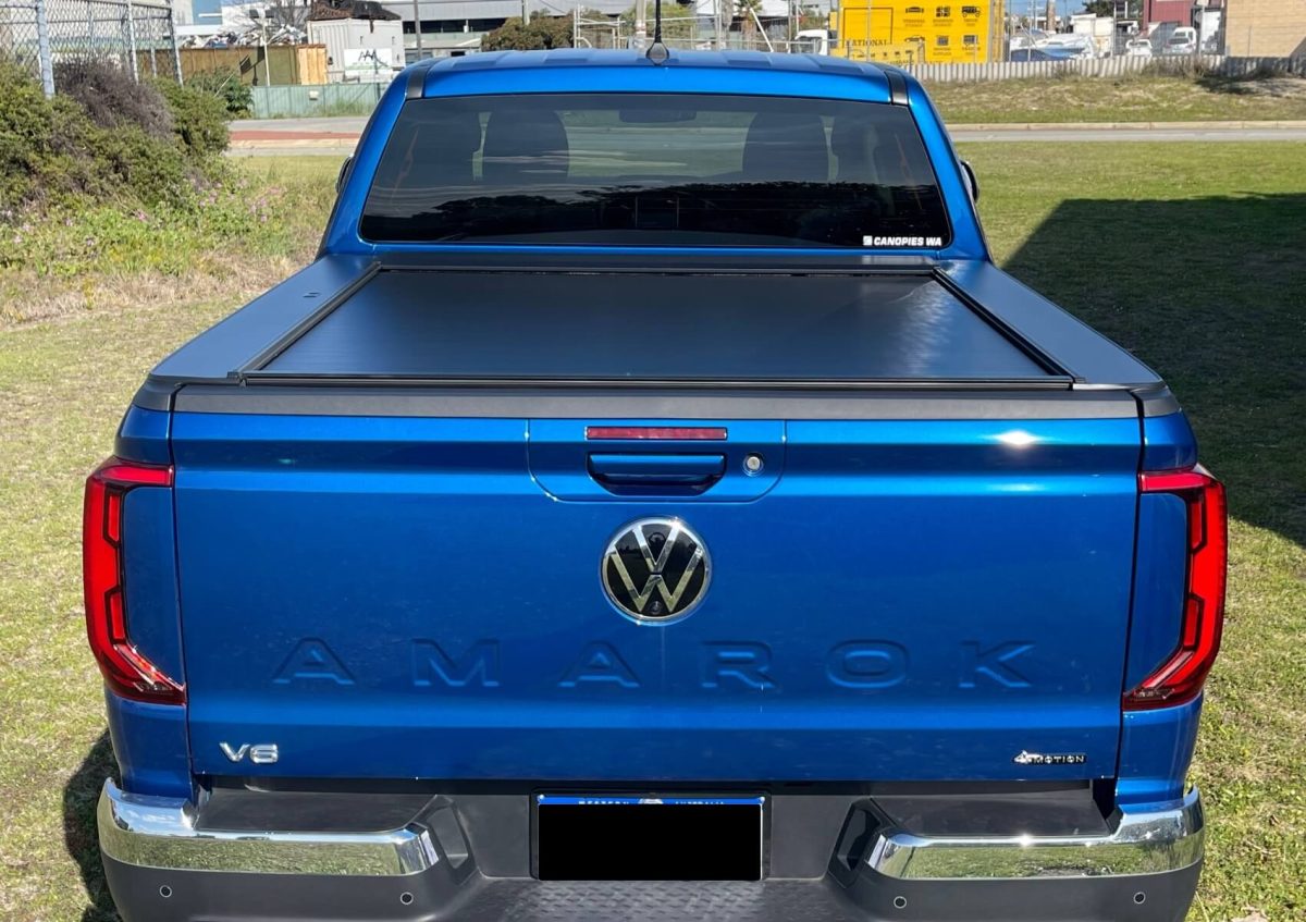 back view of electric roller lid installed on blue Volkswagen Amarok