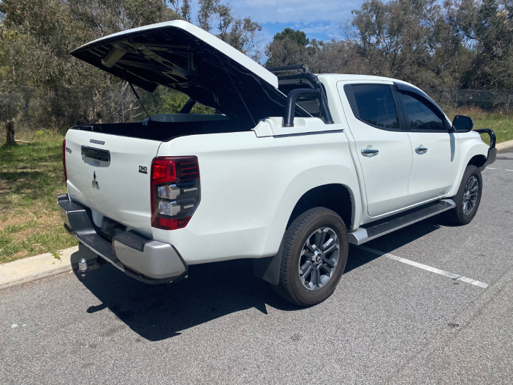 Manual Hard Lid Open on White Ute